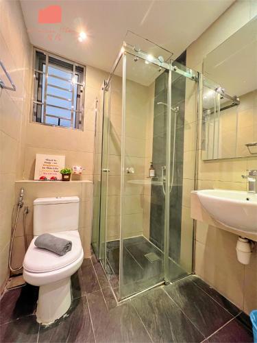 a bathroom with a shower and a toilet and a sink at Maison life 小居屋 The Loft Imago in Kota Kinabalu