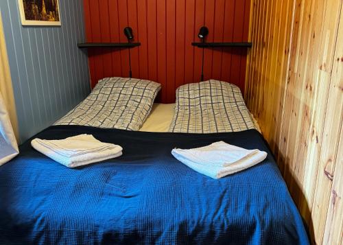 Ένα ή περισσότερα κρεβάτια σε δωμάτιο στο Sandviken Camping