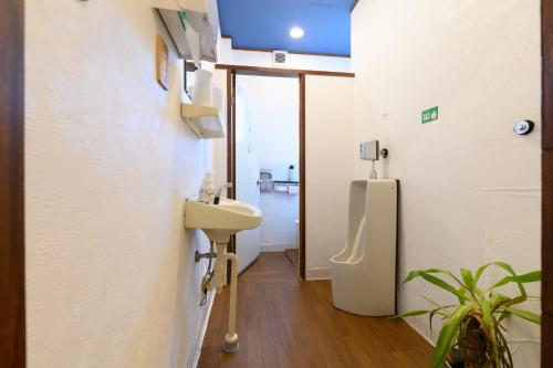 a bathroom with a sink and a toilet at OYO Ryokan Hamanako no Yado Kosai - Vacation STAY 38804v in Kosai