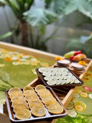 a table with plates of pastries on a table at Flowering Villa in Xiaoliuqiu