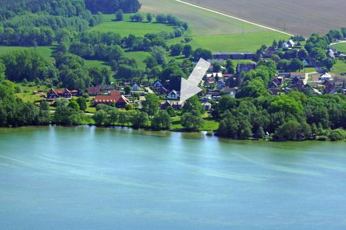 an aerial view of a town next to a river at FEWO Seewind in Flessenow