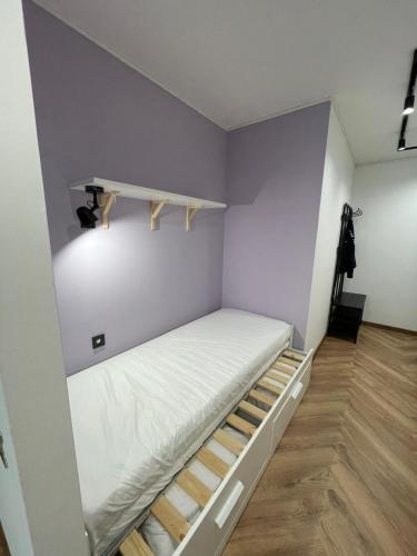 a small room with a bunk bed in it at Forest Apartment Zofia in Sella Nevea