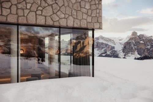 a room with windows with a view of mountains at Rifugio Alpino Pralongià in Corvara in Badia