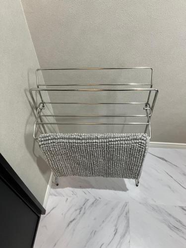a metal basket sitting on the floor in a room at 3minutes from the station Close to Asakusa, Tokyo Station and Narita Airport in Tokyo