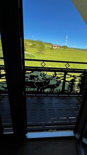 a view of a view of a field from a window at Садиба Кичера та Кичера Еко in Mizhhirʼʼya