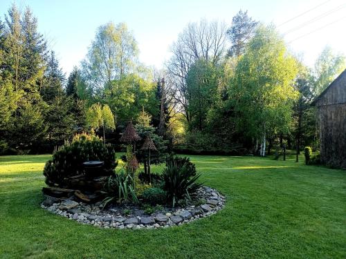 Taman di luar Polna Zagroda - domek do wynajęcia