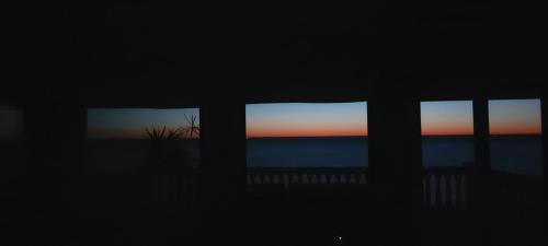 a view of the ocean from a room with windows at Mar-Beach front apartment in Jávea in Jávea