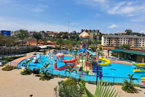 a large water park with a water slide at Kira Haven in Kira