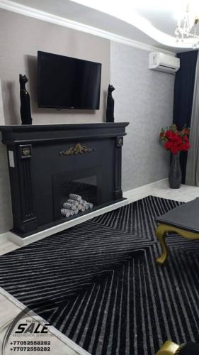 טלויזיה ו/או מרכז בידור ב-Элитная 2-комнатная квартира в районе Болашак