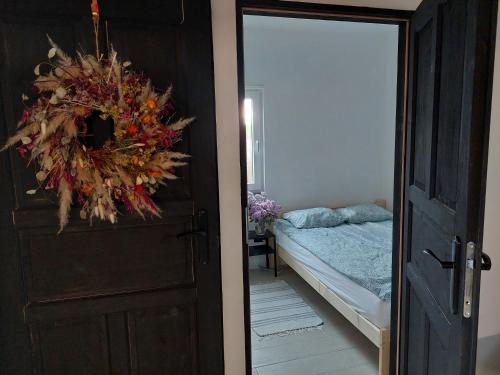 Postel nebo postele na pokoji v ubytování Domy Mazury Kurp Dom