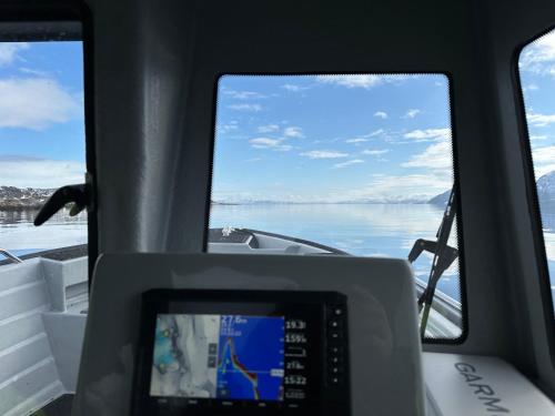 a view from the front of a boat on the water at Bestefarhuset in Hakkstabben