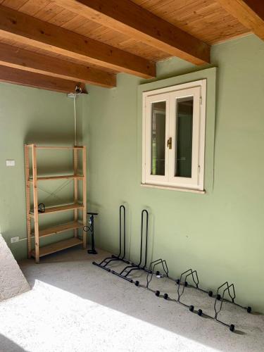 a room with a wall with a window and a shelf at Palazzo Gessi Room and Breakfast in Borghi