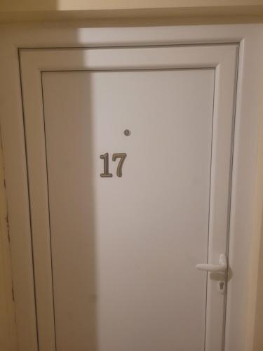 a door with the number on it at Golden Apartment in Valjevo