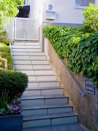 a set of stairs leading up to a house at Baker's Pond Apartment Two in Velden am Wörthersee