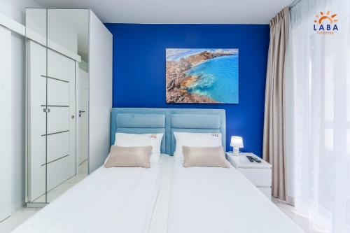 Postel nebo postele na pokoji v ubytování LABA Kołobrzeg Apartamenty Kasprowicza 20AB