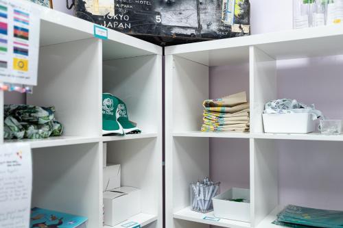 a white pantry with white shelves at Pax Lodge in London