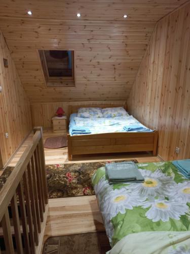 Posteľ alebo postele v izbe v ubytovaní Domek nad morzem Gdańsk Sobieszewo