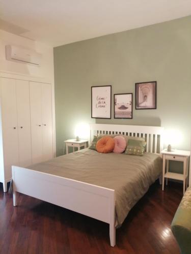 a bed with two pillows on it in a bedroom at B&B Le Coccole di Galluzzo Gabriele in Aragona