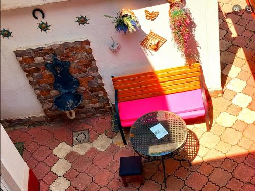 an overhead view of a bench and a table at 2A Apartments Bascarsija in Sarajevo