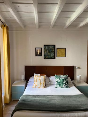 a bedroom with a large bed with pillows on it at Charming Navona in Rome
