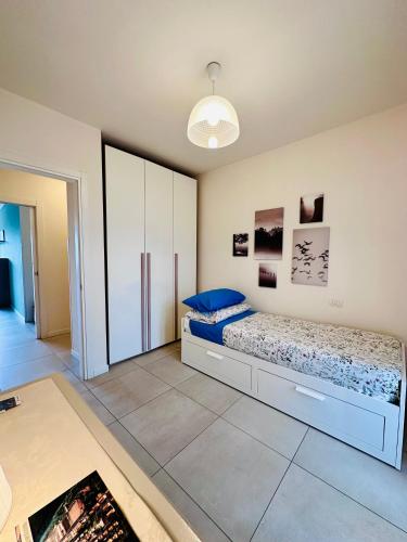 Ένα ή περισσότερα κρεβάτια σε δωμάτιο στο Angelina House Cisano