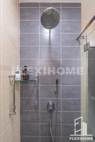 a bathroom with a shower with gray tiles at 10am-6pm, SAME DAY CHECK IN AND CHECK OUT, Work From Home, Shaftsbury-Cyberjaya, Comfy Home by Flexihome-MY in Cyberjaya