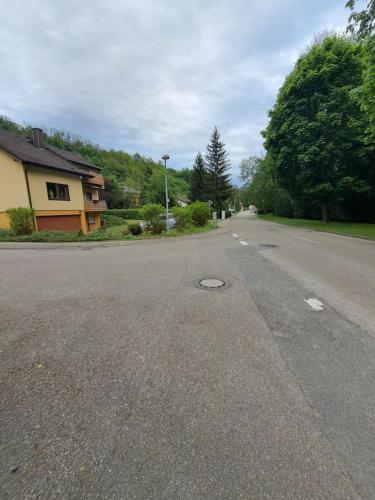 an empty street with a house on the side of the road at Wohnung Widdern in Widdern