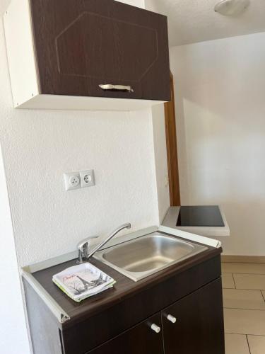 a kitchen with a sink and a counter top at Villa Bellevue in Neum