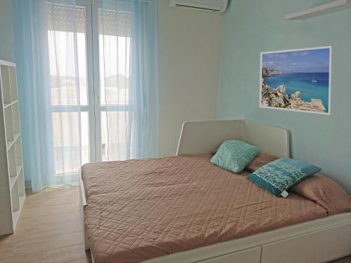 Postel nebo postele na pokoji v ubytování Casa La Fenice Favignana