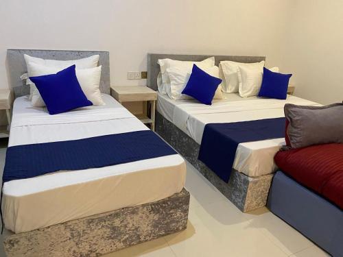 מיטה או מיטות בחדר ב-Rose Villa