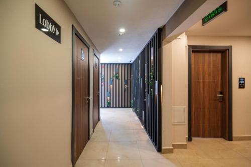 a hallway of a building with two doors and a hallwayngth at MAGİA HOTEL in Istanbul