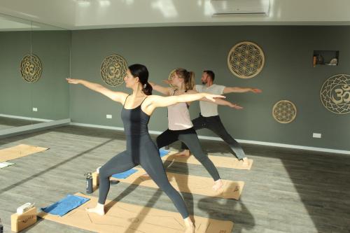 a group of people dancing in a dance studio at Xhale Azores in Angra do Heroísmo