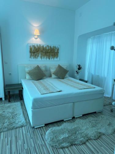 a bedroom with a large bed with blue lighting at Romantik Pearl with free EV Ch-Station in Valbandon