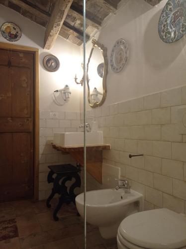 a bathroom with a toilet and a sink at Tenuta Torre Diana in Mordano