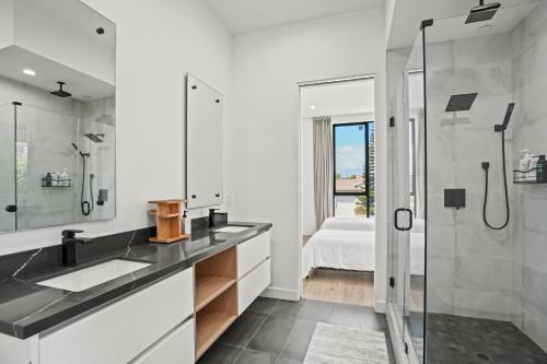 a bathroom with a sink and a shower at New Lavish Elegant 3BR Home in Mar Vista, Pet Friendly! 10min to Venice Beach! in Los Angeles
