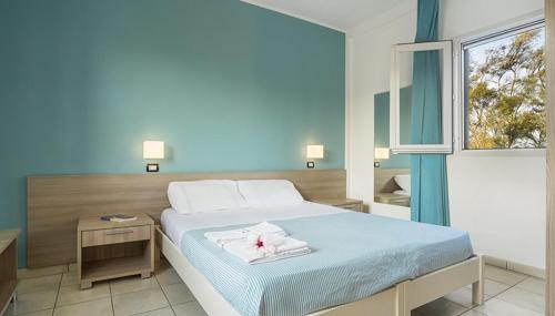 Posteľ alebo postele v izbe v ubytovaní Hotel dei Bizantini & Villaggio Campo dei Messapi