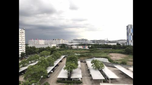 a view of a park with trees and buildings at OP Open View เมืองทอง T12 impact muang thong thani in Ban Bang Phang