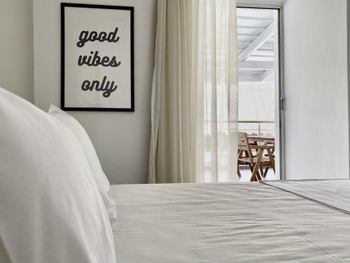 a bedroom with a bed and a window with a table at Central, spacious and bright 2-bedroom apartment By Estio Comfort Living in Heraklio