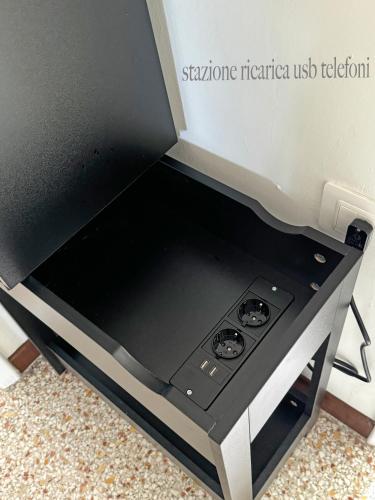 a stove top oven sitting on top of a counter at Rossini apartment in Sassoferrato