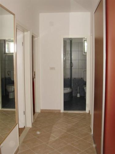 an empty hallway with a bathroom with a toilet at Mazuran2 in Hvar