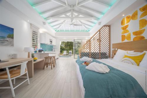 Postel nebo postele na pokoji v ubytování Cocoonhuts Résidences Martinique