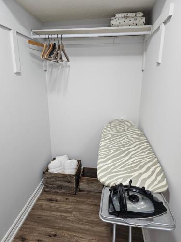 a room with a bed in the corner of a room at Poolside entire lower level apt in Whitby