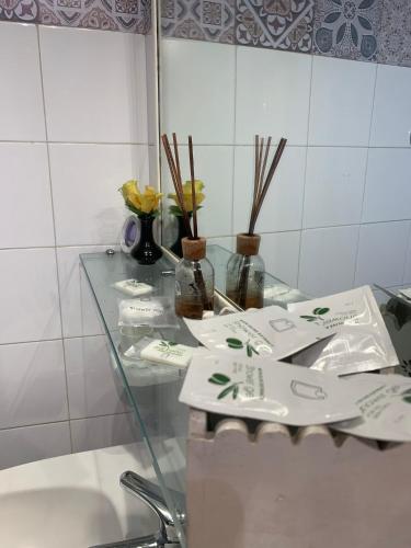 a glass table in a bathroom with a sink at La Zagara B&B Centro Catania Vicino Duomo in Catania