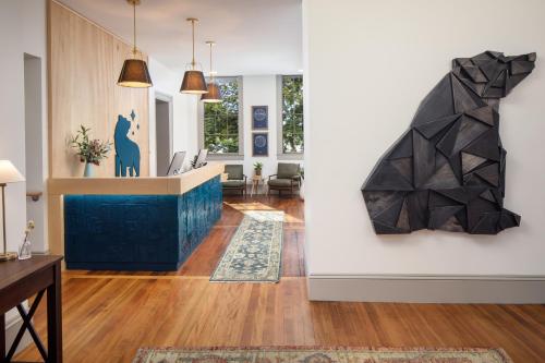 a lobby with a cat on the wall at Hotel Ursa in Orono