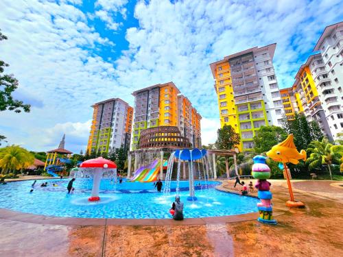 a water park with a water slide and buildings at BY LG Water Themepark Suites Melaka By GGM in Melaka