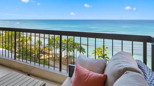 a balcony with a view of the beach and the ocean at Luxury Oceanfront 2 Bedroom Apartment at Waikiki Beach Tower in Honolulu