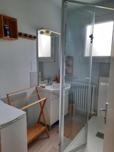 a bathroom with a glass shower and a sink at Villa La Faute-sur-Mer in La Faute-sur-Mer