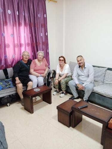a group of people sitting on a couch at شقة فاخرة مع مطل luxerious with nice view in Amman
