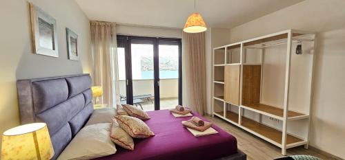 Ένα ή περισσότερα κρεβάτια σε δωμάτιο στο Villa Kajgo II