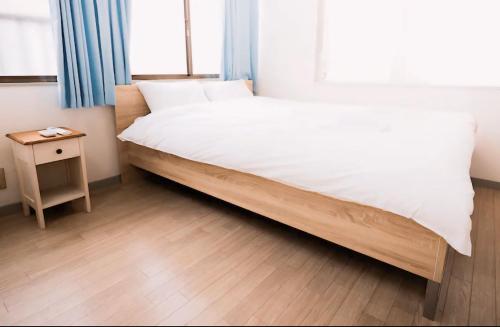 Posteľ alebo postele v izbe v ubytovaní 市川市TOKYO BAY DISNEY House